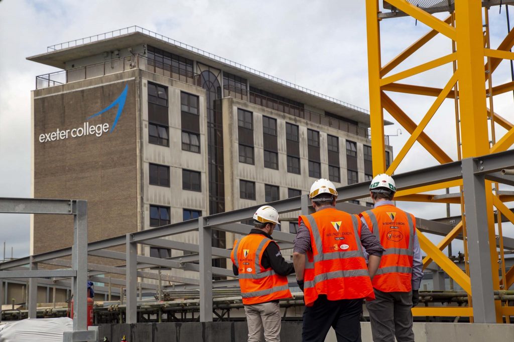 A landscape shot of some Wilmot Dixon engineers working on the D&D centre at Exeter College