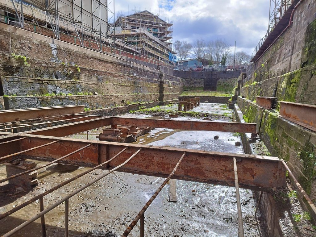 A wide shot of the ground engineering site of the Albion Dock project